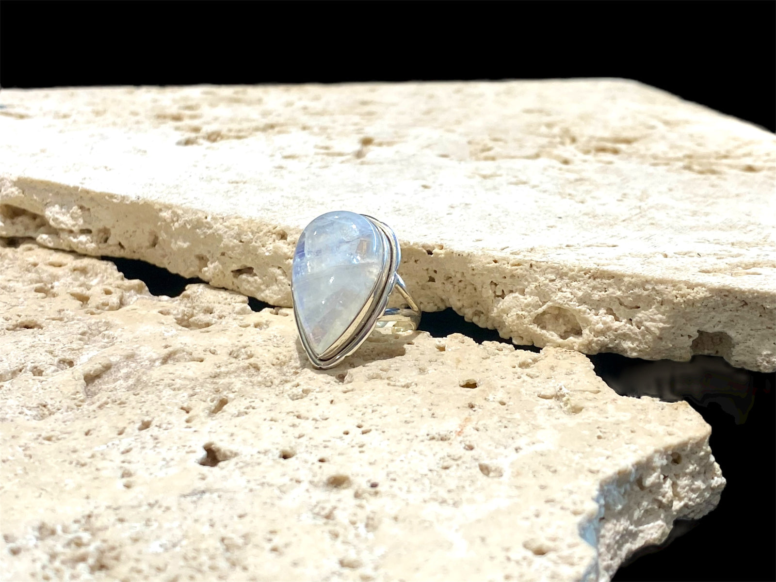 Teardrop rainbow moonstone ring set in sterling silver. Hand made in Jaipur, India. Measurements: Length of stone including bezel 2.5 cm (1 in), width 1.6 cm. Size 6 | 16.5 mm