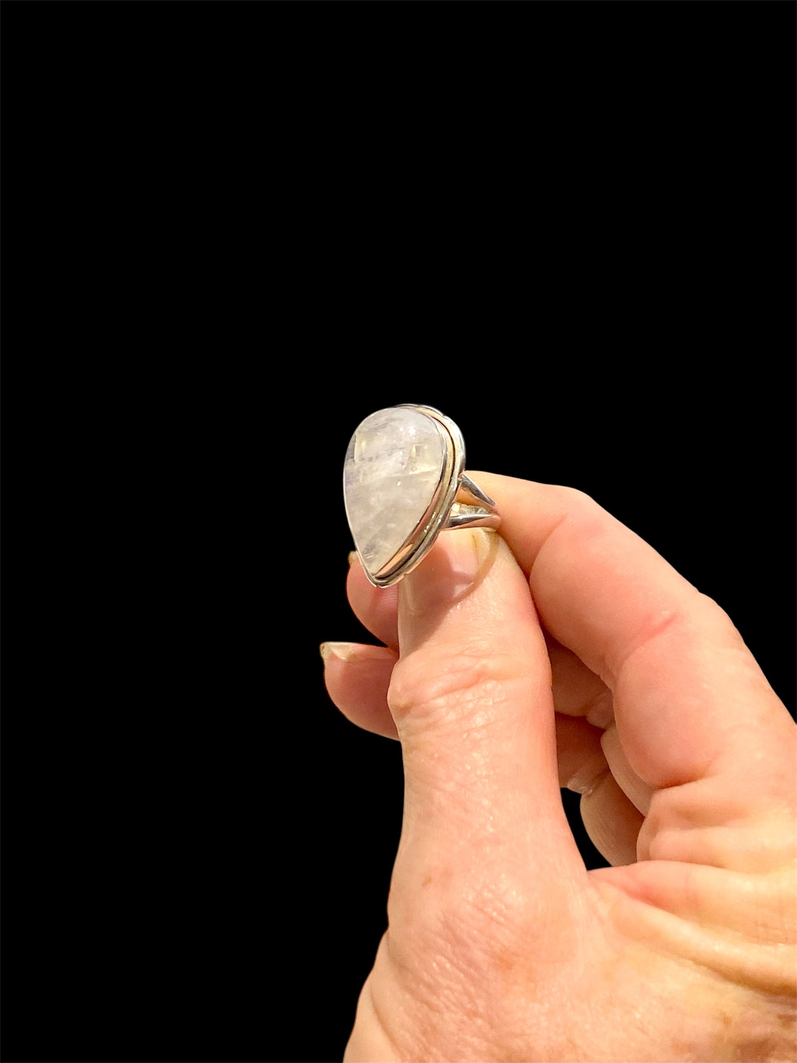 Teardrop rainbow moonstone ring set in sterling silver. Hand made in Jaipur, India. Measurements: Length of stone including bezel 2.5 cm (1 in), width 1.6 cm. Size 6 | 16.5 mm