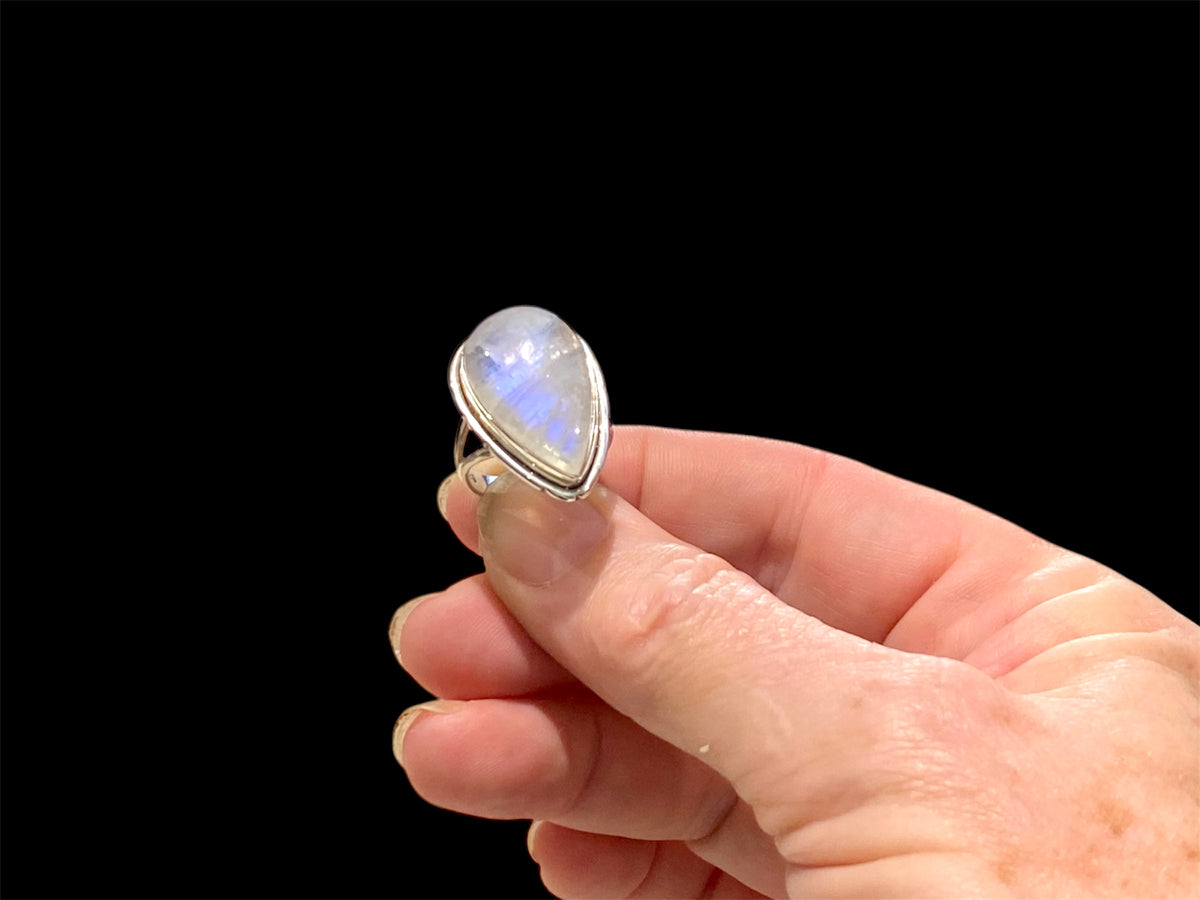 Teardrop rainbow moonstone ring set in sterling silver. Hand made in Jaipur, India. Measurements: Length of stone including bezel 2.5 cm (1 in), width 1.6 cm. Size 6 | 16.5 mm