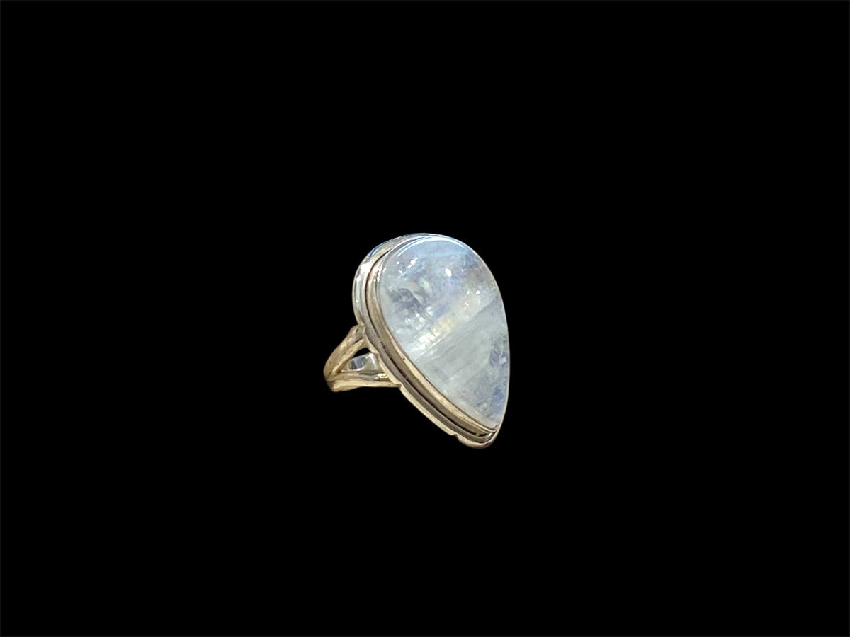 Teardrop rainbow moonstone ring set in sterling silver. Hand made in Jaipur, India. Measurements: Length of stone including bezel 2.5 cm (1 in), width 1.6 cm. Size 6 | 16.5 mm