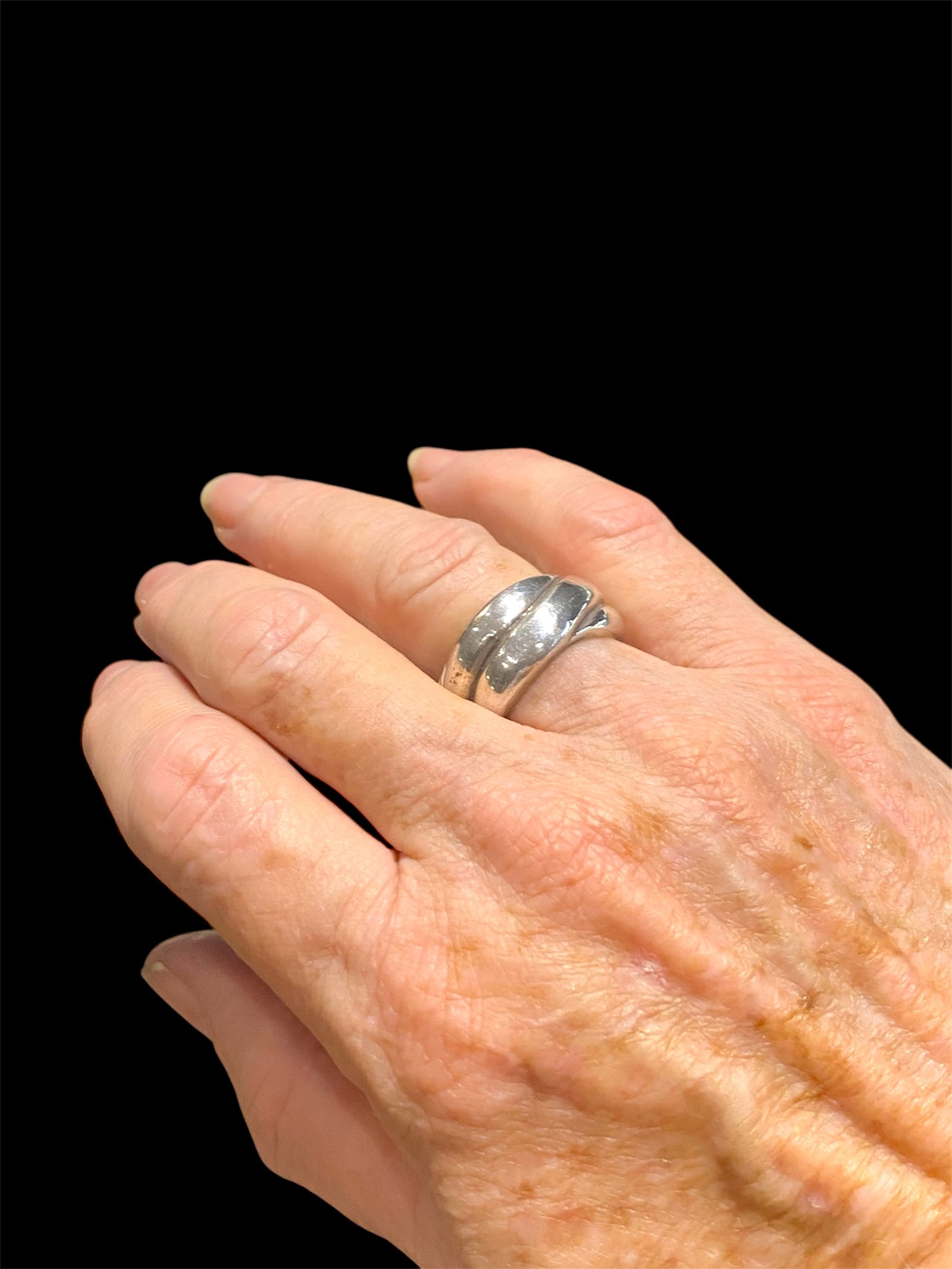 Twisted sterling silver ring. Band width 1.2 cm.