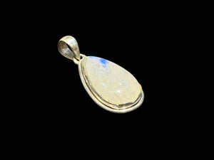Teardrop rainbow moonstone pendant set in a scalloped sterling silver mount with a generous bail to take a large chain or cord. A lovely stone with blue colour and fire.

Measurements:Length including bail 4 cm, width at widest point 2 cm