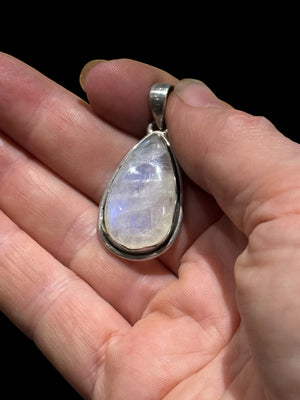 Teardrop rainbow moonstone pendant set in a scalloped sterling silver mount with a generous bail to take a large chain or cord. A lovely stone with blue colour and fire.&nbsp;

Measurements:&nbsp;Length including bail 4 cm, width at widest point 2 cm