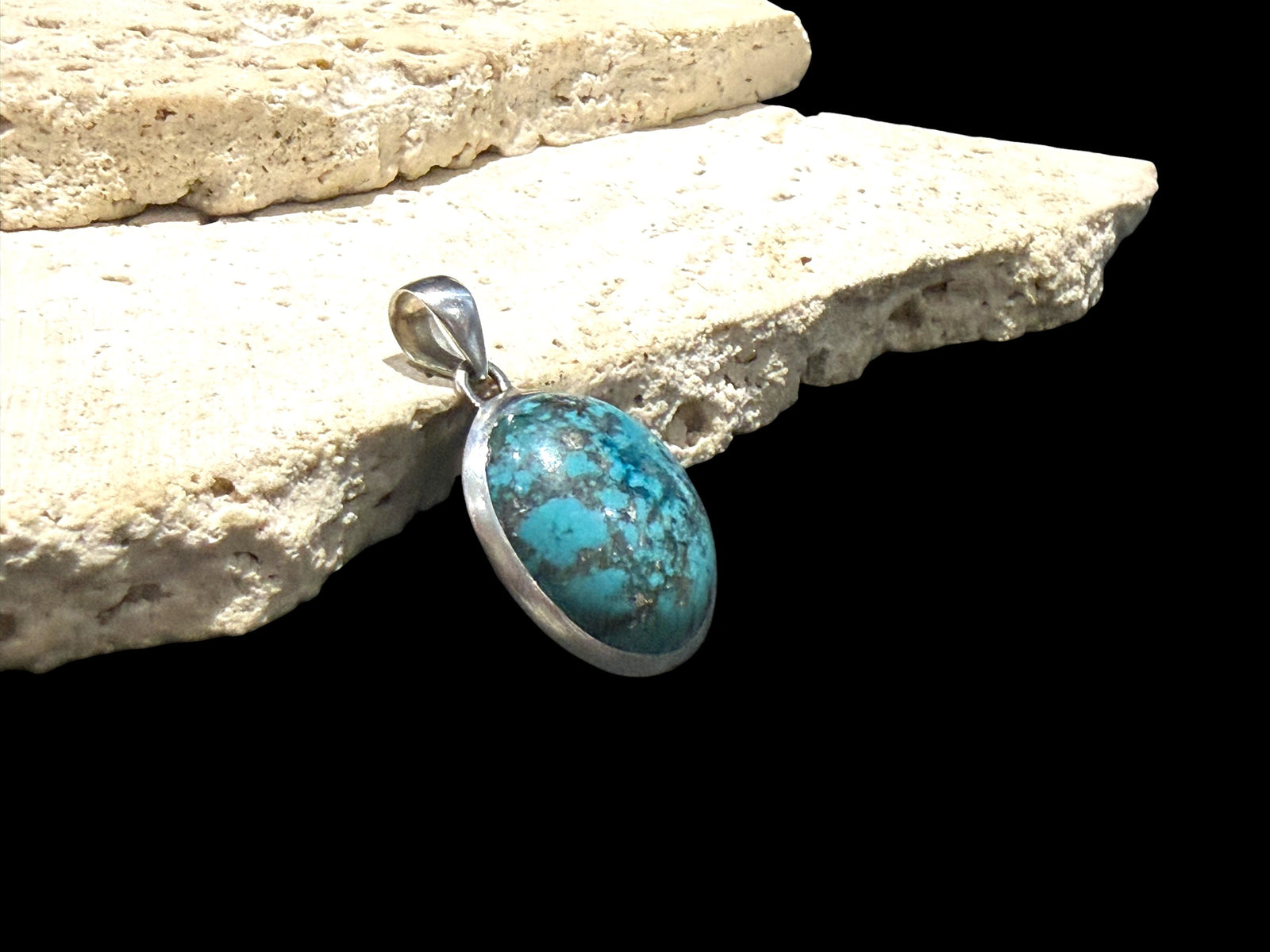 Large turquoise pendant with sterling silver bezel and bail.  Height 4 cm including bail, pendant 3 x 2.4 cm