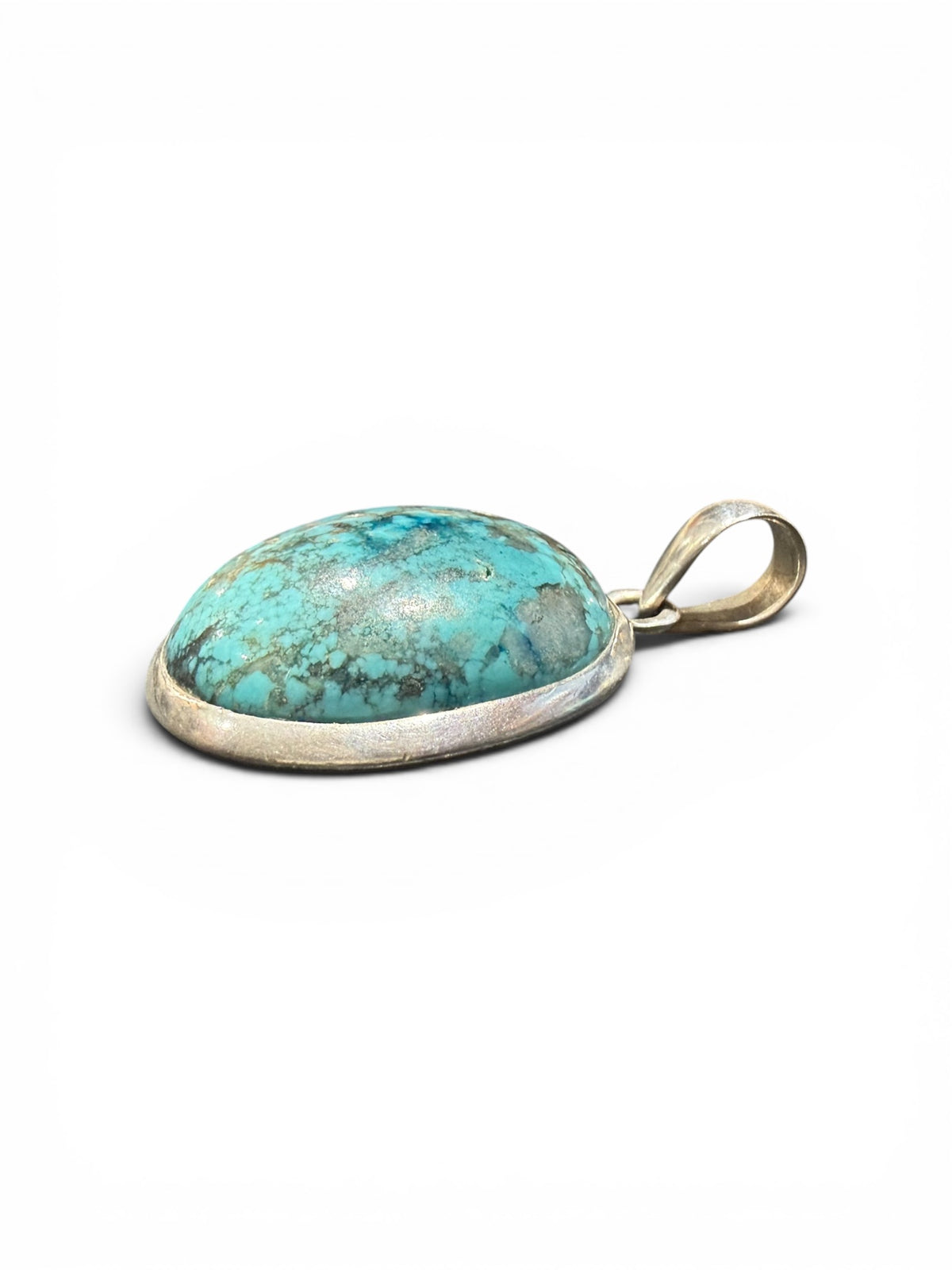 Large turquoise pendant with sterling silver bezel and bail.  Height 4 cm including bail, pendant 3 x 2.4 cm