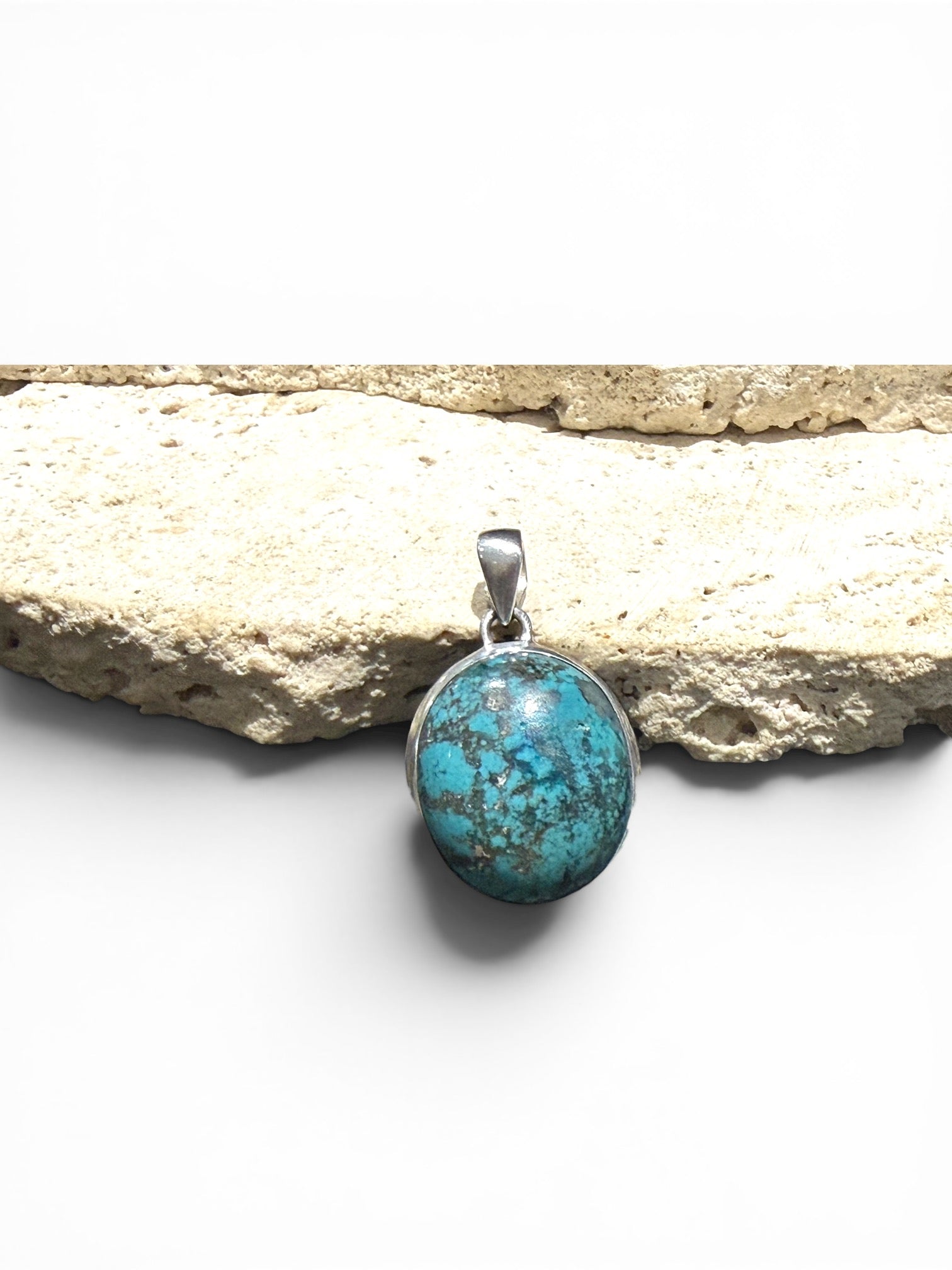 Large turquoise pendant with sterling silver bezel and bail.  Height 4 cm including bail, pendant 3 x 2.4 cm