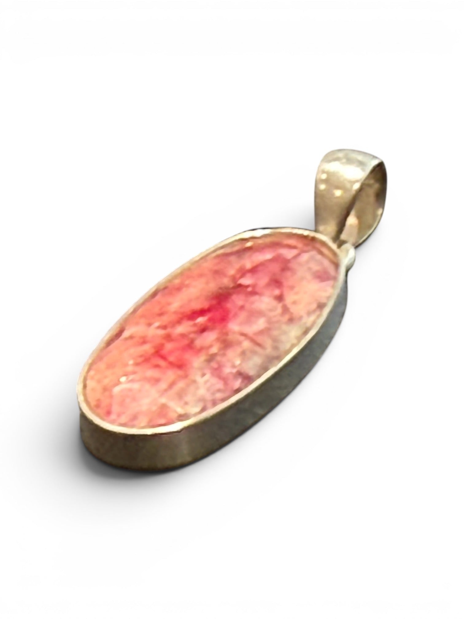 Our ruby pendant features a large facet cut stone set in sterling silver, height 4 cm including bail, width 1.2 cm.