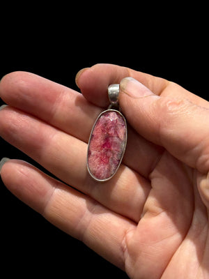 Our ruby pendant features a large facet cut stone set in sterling silver, height 4 cm including bail, width 1.2 cm.