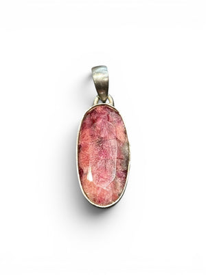 Our ruby pendant features a large facet cut stone set in sterling silver, height 4 cm including bail, width 1.2 cm.