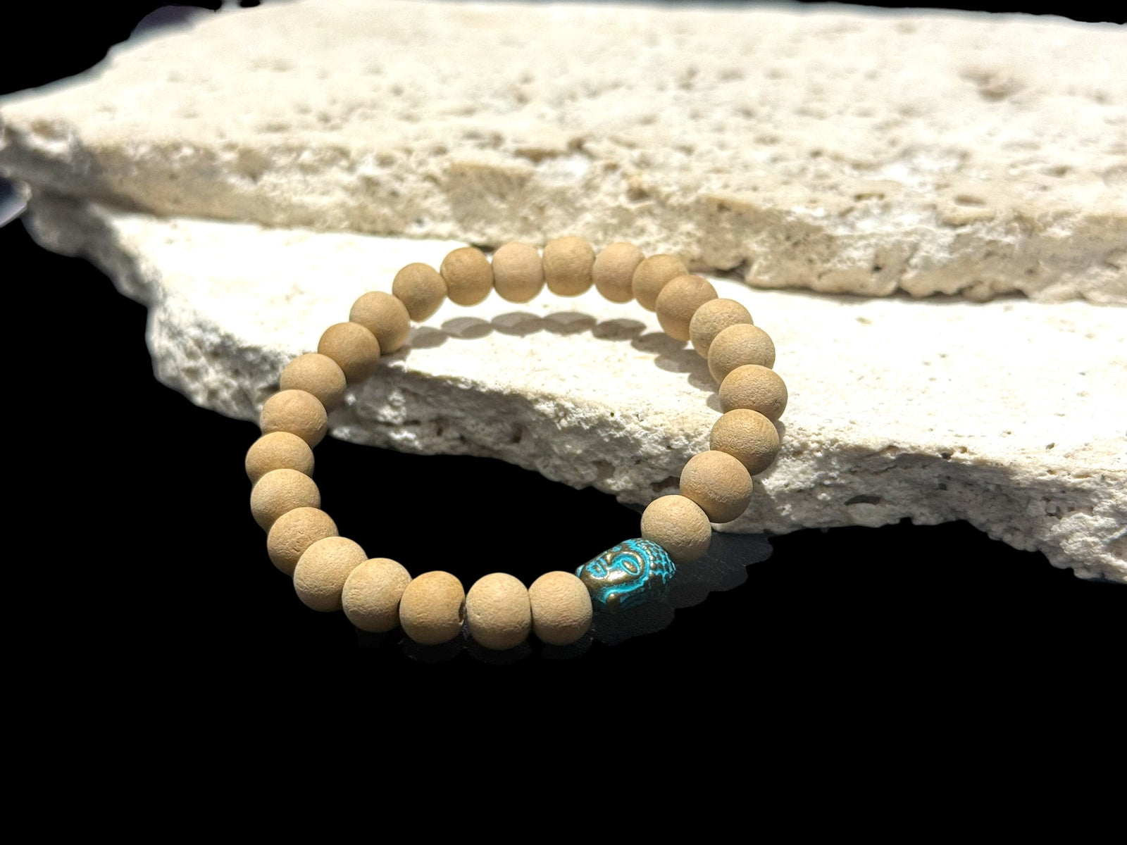 Women or men’s yoga bracelet. Made from real sandalwood and features a detailed brass Buddha head bead. On sturdy elastic cord.

Sandalwood beads 6 mm diameter, Buddha bead is 1 cm in length