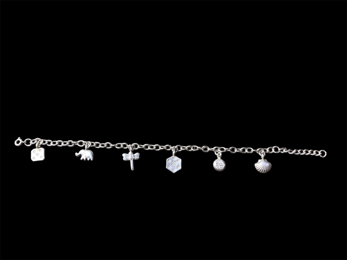 Sterling silver charm bracelet with 6 charms including elephant, dragonfly and seashell, with room to add more charms. With extension chain. Length 17.5 cm, with extension chain 22 cm 