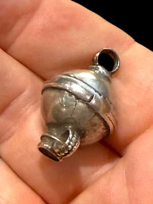 Unique tribal bead with two offset bails. Copper and silver, small glass bead set at one end. Early 20th C, northern India. Length 2.7 cm, diameter 1.7 cm.