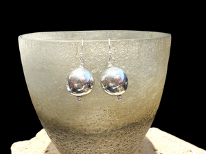 Elegant, simple earrings feature a ball shape. Sterling silver. Measurements: 3 cm length including hook