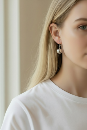 Elegant, simple earrings feature a ball shape. Sterling silver. Measurements: 3 cm length including hook