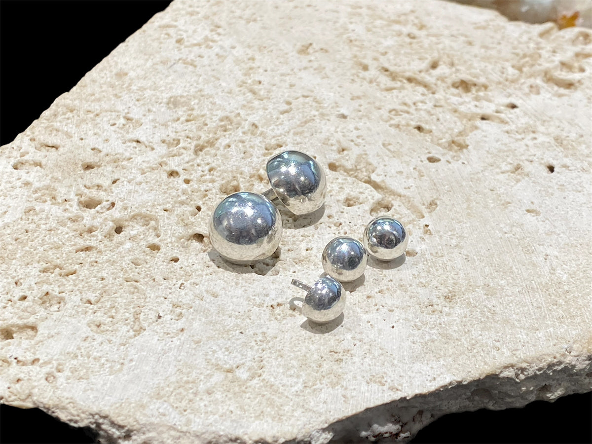 Sterling silver buttons. Large loops/bails. Sturdy construction, will not dent.  Diameter large 1.5 cm, small 0.8 cm
