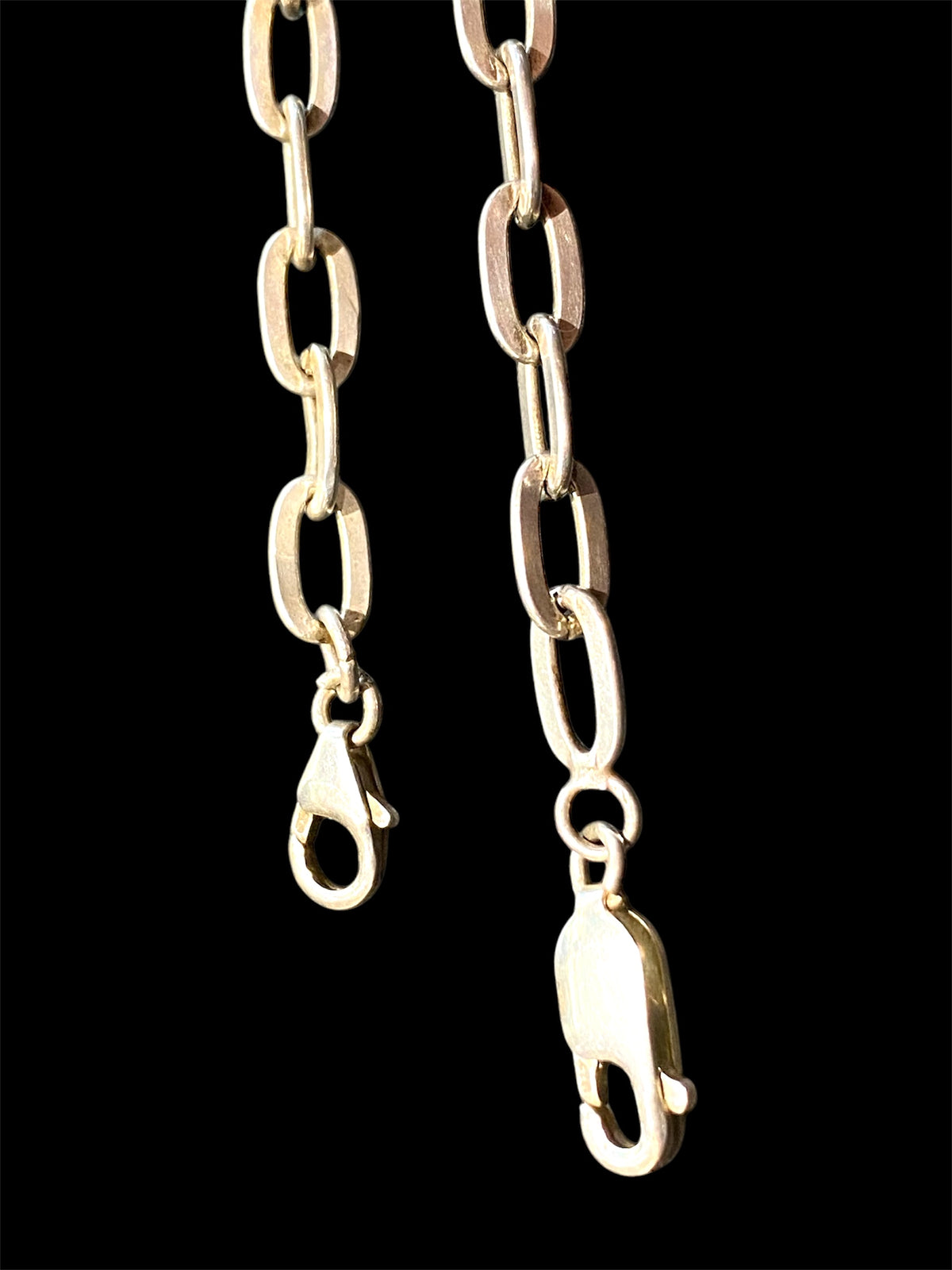 Sterling silver link bracelet. Wear as an elegant piece of jewellery on its own, stacked with other bracelets or use it as a base to add your own charms. These are unisex bracelets. Long 20 cm, short 15.8 cm
