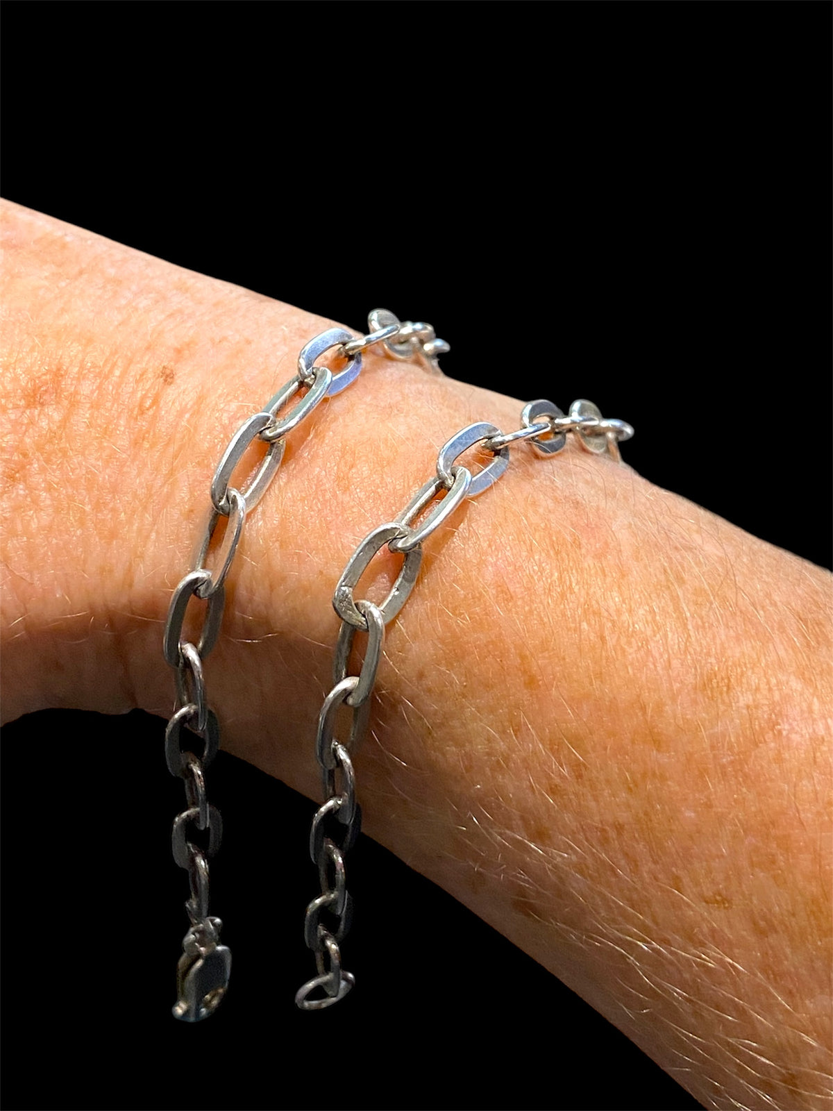 Sterling silver link bracelet. Wear as an elegant piece of jewellery on its own, stacked with other bracelets or use it as a base to add your own charms. These are unisex bracelets. Long 20 cm, short 15.8 cm
