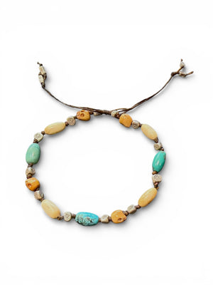 Yak bone skull beads, antique Tibetan turquoise, vintage Kachin bone and Karen hill tribe silver. Strung on sturdy waxed cord and adjustable. 20 cm or larger