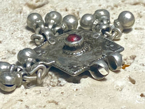 Square high grade silver amulet with dangles and gem decoration. Early to mid 19th century, Rajasthan. Note that the bails are very worn as shown. Height with dangles and bail 4 cm, width 4 cm