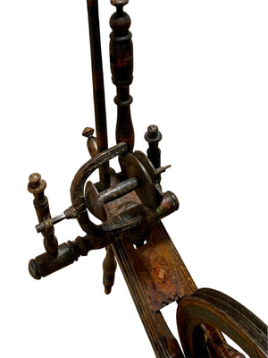 European handcrafted Saxony spinning wheel with excellent aged patina. 19th century. Handmade from turned wood.