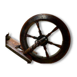 European handcrafted Saxony spinning wheel with excellent aged patina. 19th century. Handmade from turned wood.