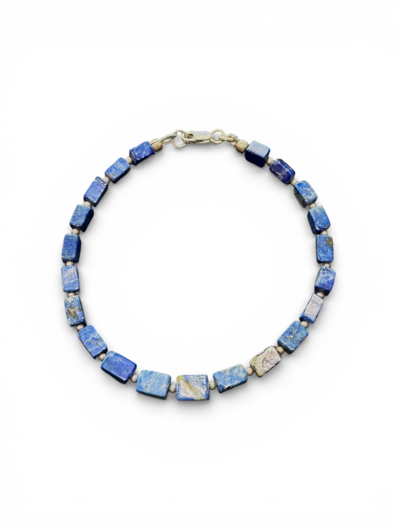 Organic look irregular square cut lapis lazuli bead and silver bracelet. 