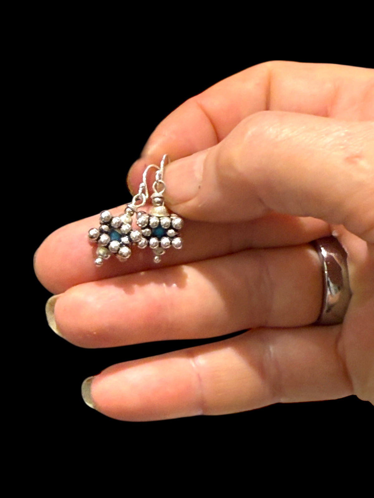 Square geometric earrings feature an open shape with a blue turquoise bead nestled in the very centre. Sterling silver. Measurements: 2.8 cm length including hook