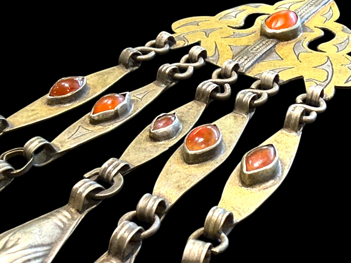 Tekke Turkoman women's pendant. High grade silver, 24k gold fire gilding, carnelian stones. All dangles are original. Early 20th C, height 15 cm