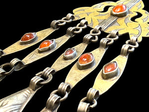 Tekke Turkoman women's pendant. High grade silver, 24k gold fire gilding, carnelian stones. All dangles are original. Early 20th C, height 15 cm