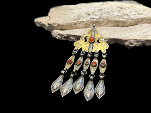 Tekke Turkoman women's pendant. High grade silver, 24k gold fire gilding, carnelian stones. All dangles are original. Early 20th C, height 15 cm
