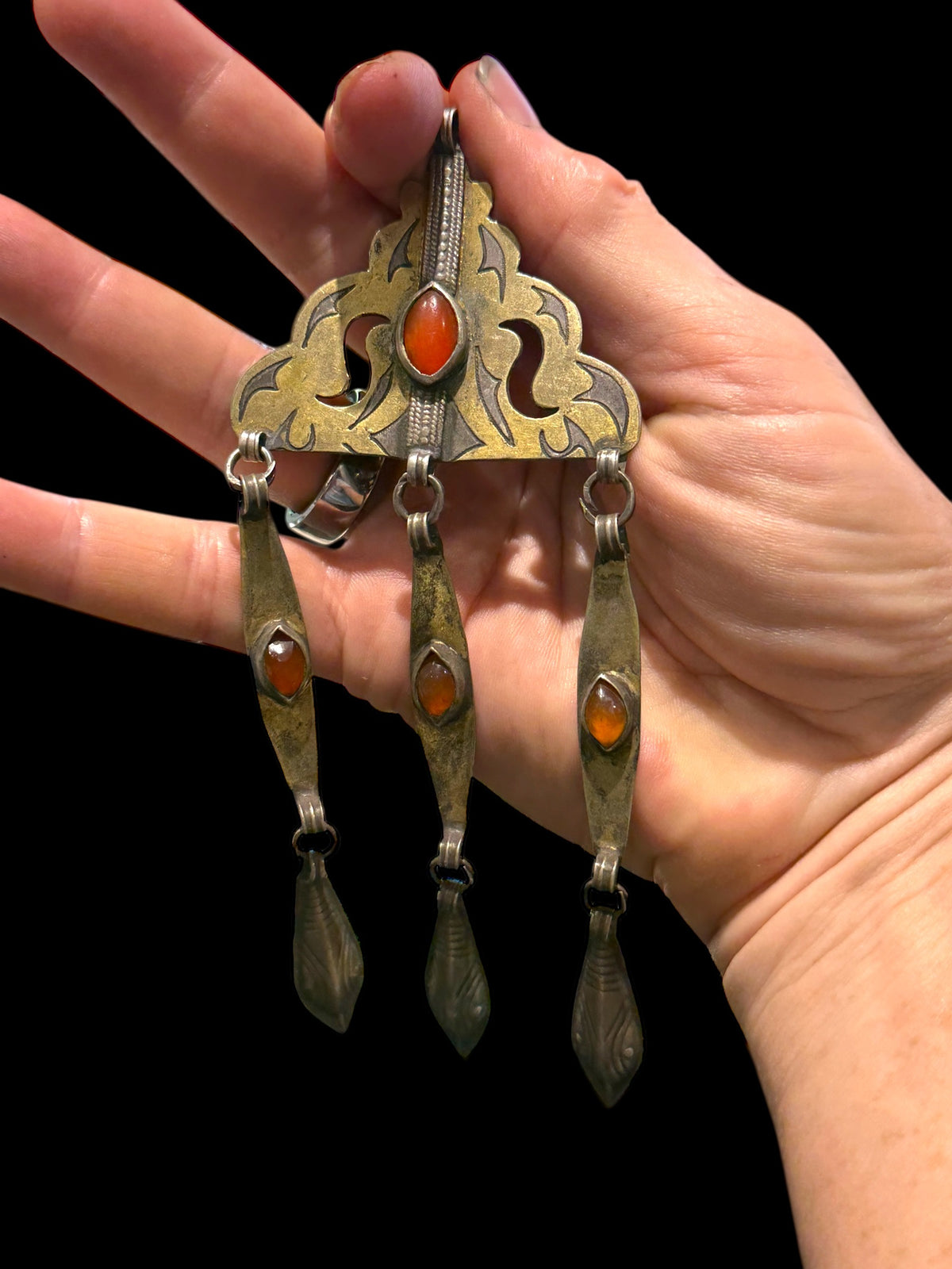 Tekke Turkoman women's pendant. High grade silver, 24k gold fire gilding, carnelian stones. All dangles are original. Early 20th C, height 14.6 cm
