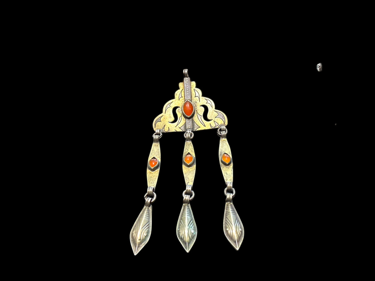 Tekke Turkoman women's pendant. High grade silver, 24k gold fire gilding, carnelian stones. All dangles are original. Early 20th C, height 14.6 cm
