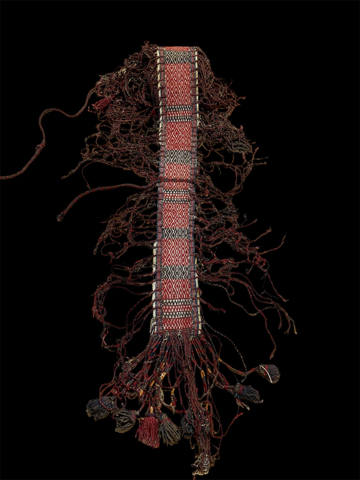 Intricately woven tent band. Afghanistan, early 20th century. Excellent condition, with elaborate fringing on both sides and richly interwoven end tassels. Length 5 metres