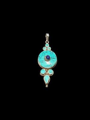 Classic Tibetan pendants, consisting of panels of turquoise and other stones set in sterling silver. These turquoise pendants are handmade in Nepal by Tibetan craftsmen.
