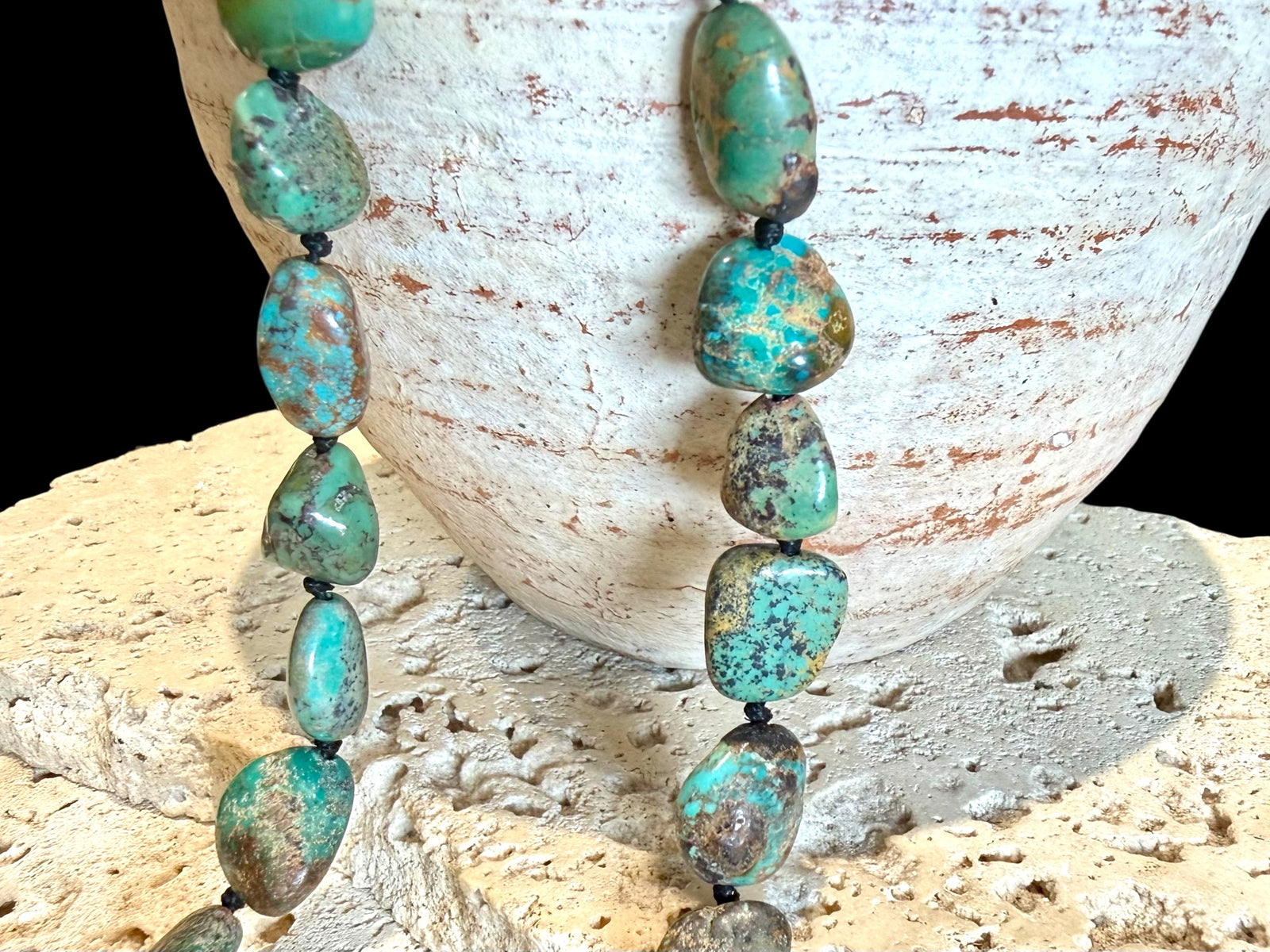 A necklace crafted from Tibetan turquoise, knotted between each bead. Finished with sterling silver beads and clasp, length 53.5 cm