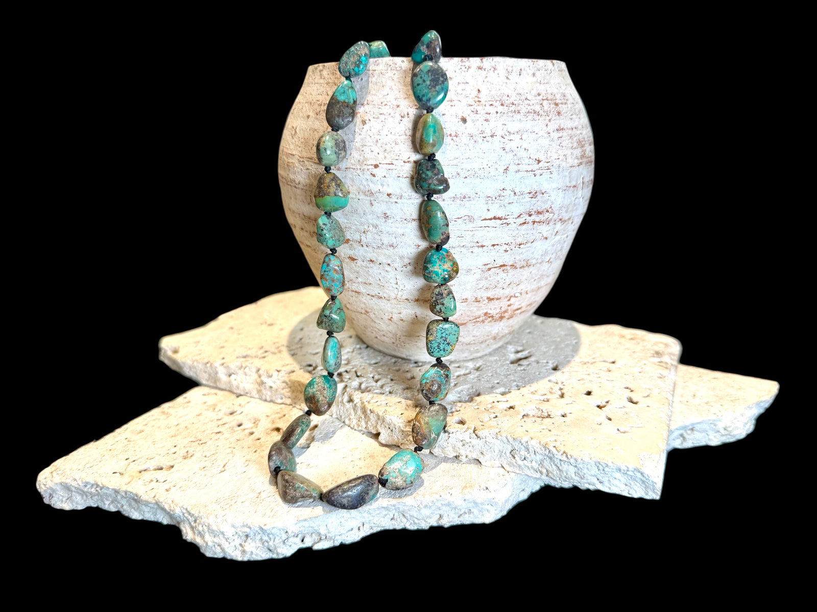 A necklace crafted from Tibetan turquoise, knotted between each bead. Finished with sterling silver beads and clasp, length 53.5 cm