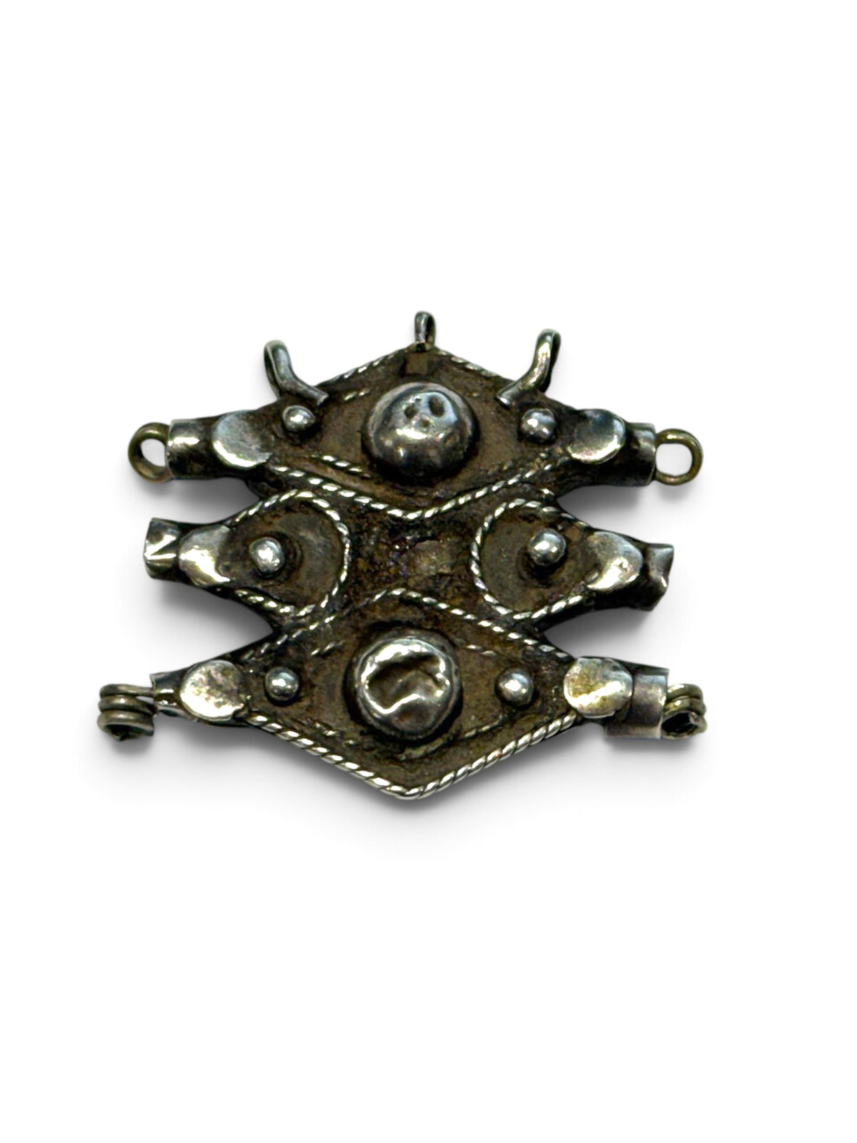 Antique Tunisian pendant with 3 bails and tubular fittings at back for stringing onto a necklace. High grade silver, 19th century. Height 3.8 cm, width 4 cm