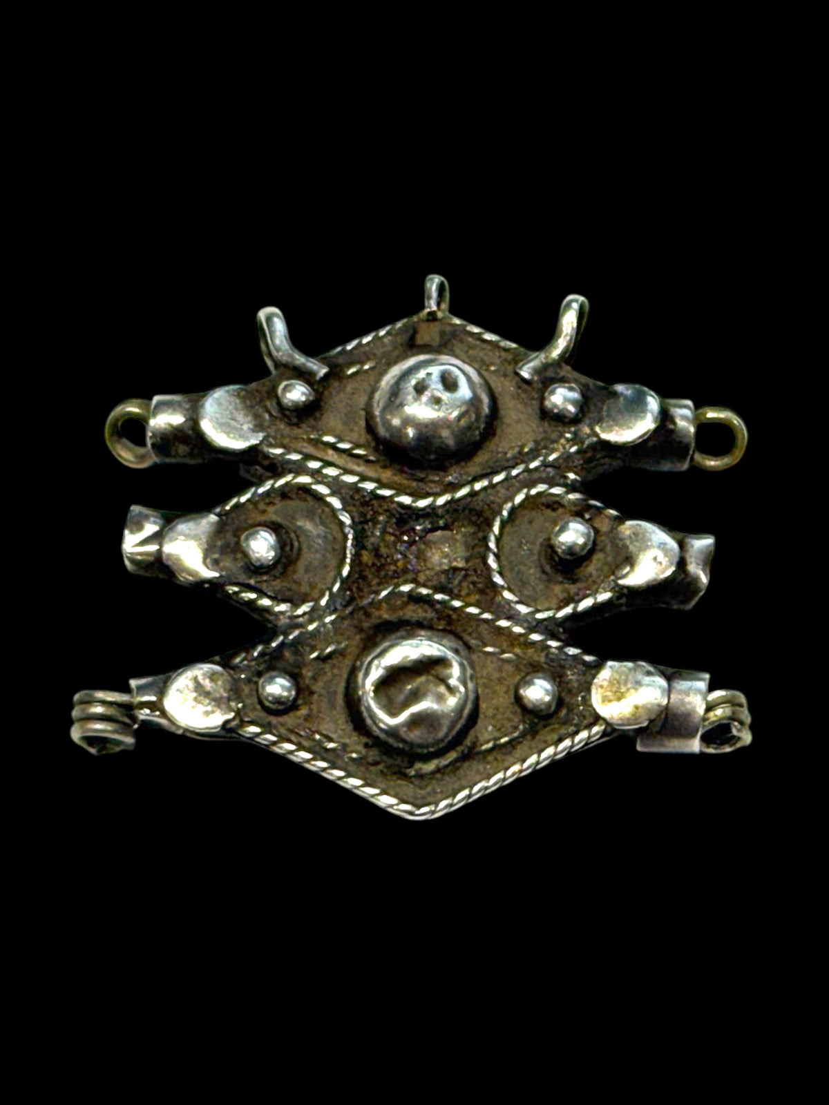Antique Tunisian pendant with 3 bails and tubular fittings at back for stringing onto a necklace. High grade silver, 19th century. Height 3.8 cm, width 4 cm