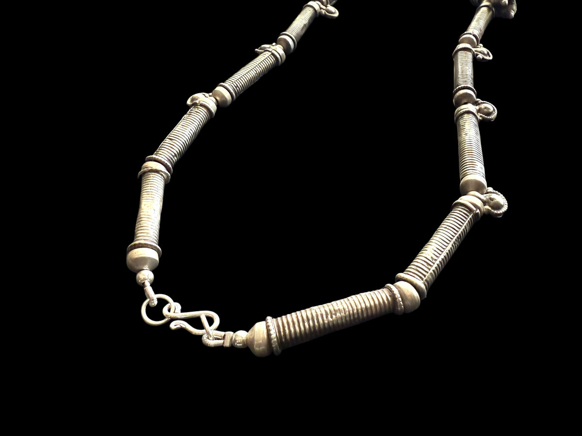 Unique necklace of antique silver components - Afghan tube beads, Turkoman pendant, double amulets from Pakistan and small Indian bell pendants. Length 56 cm