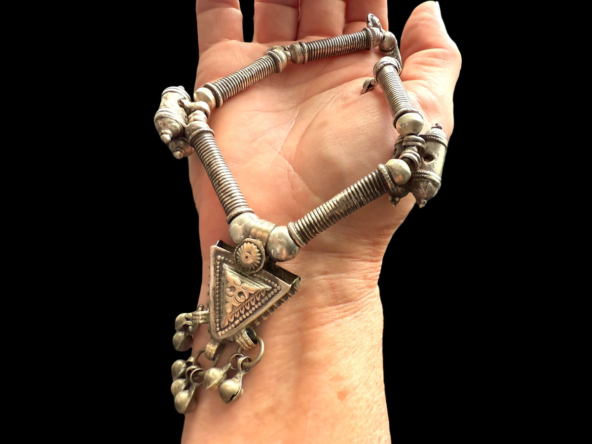 Unique necklace of antique silver components - Afghan tube beads, Turkoman pendant, double amulets from Pakistan and small Indian bell pendants. Length 56 cm