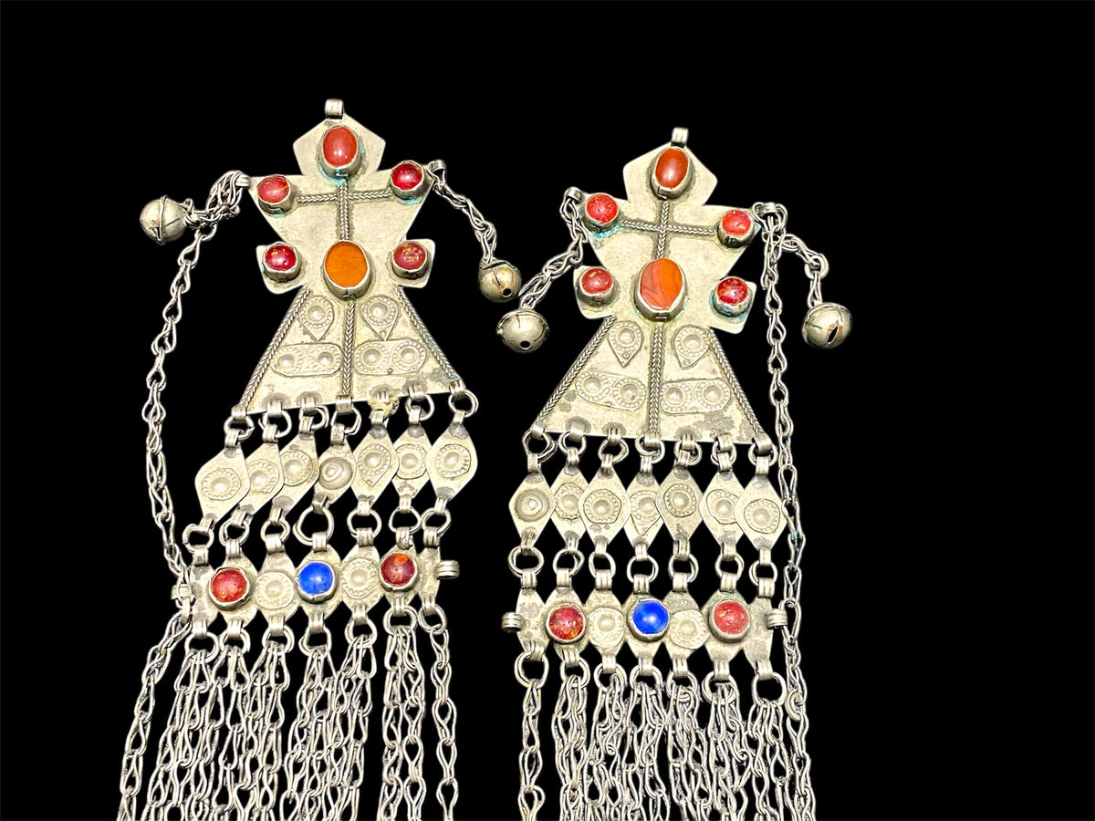 Turkoman headdress jewellery. Low grade or no silver, carnelian and glass stones, leaf and diamond shaped dangles and bells. Ersari. Mid 20th C. Length 43 cm