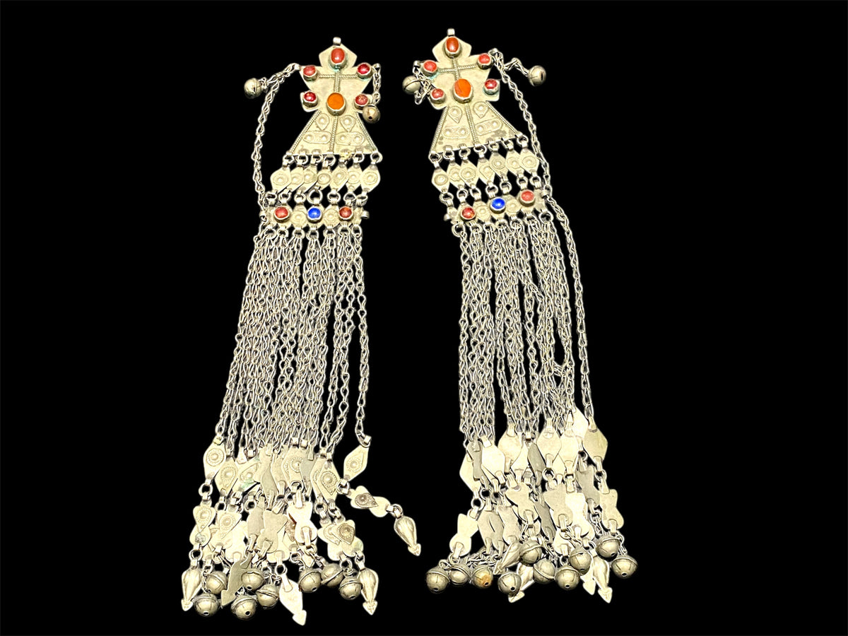 Turkoman headdress jewellery. Low grade or no silver, carnelian and glass stones, leaf and diamond shaped dangles and bells. Ersari. Mid 20th C. Length 43 cm