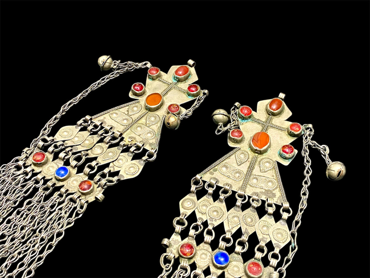Turkoman headdress jewellery. Low grade or no silver, carnelian and glass stones, leaf and diamond shaped dangles and bells. Ersari. Mid 20th C. Length 43 cm