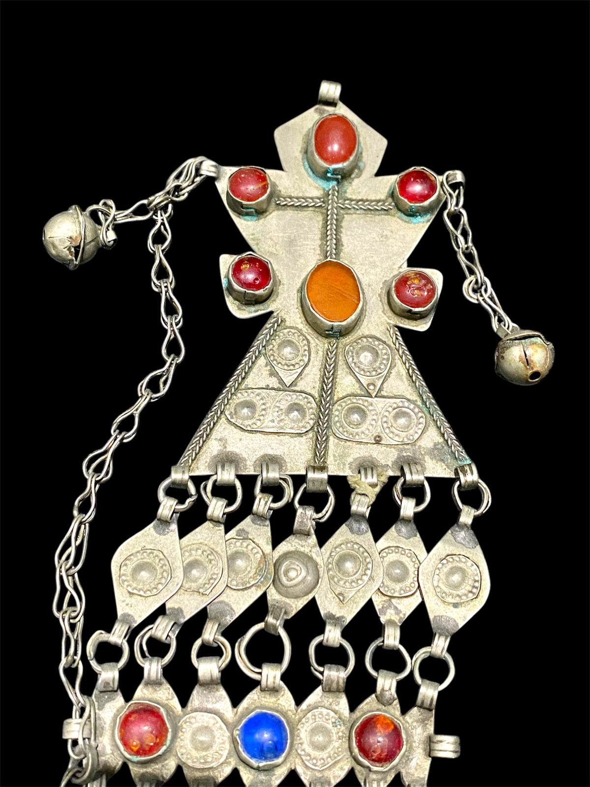 Turkoman headdress jewellery. Low grade or no silver, carnelian and glass stones, leaf and diamond shaped dangles and bells. Ersari. Mid 20th C. Length 43 cm