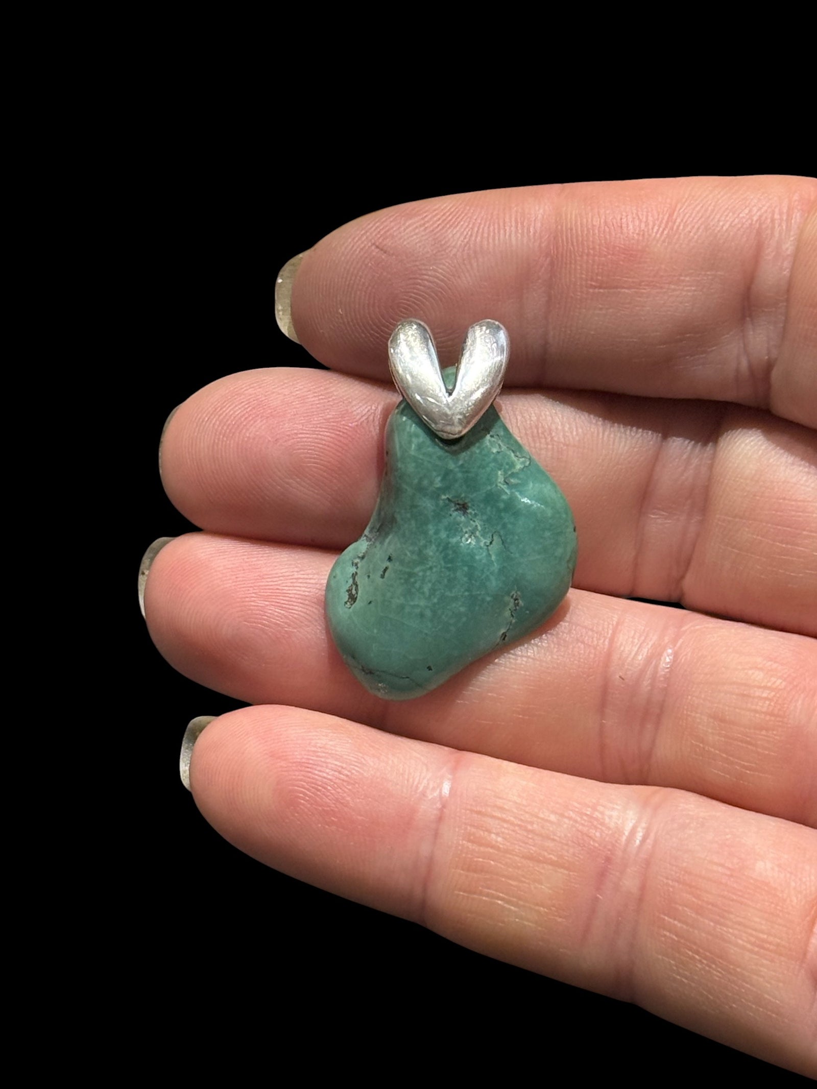 Large, unusual freeform turquoise nugget topped with a striking sterling silver bail. 3.4 cm height including bail