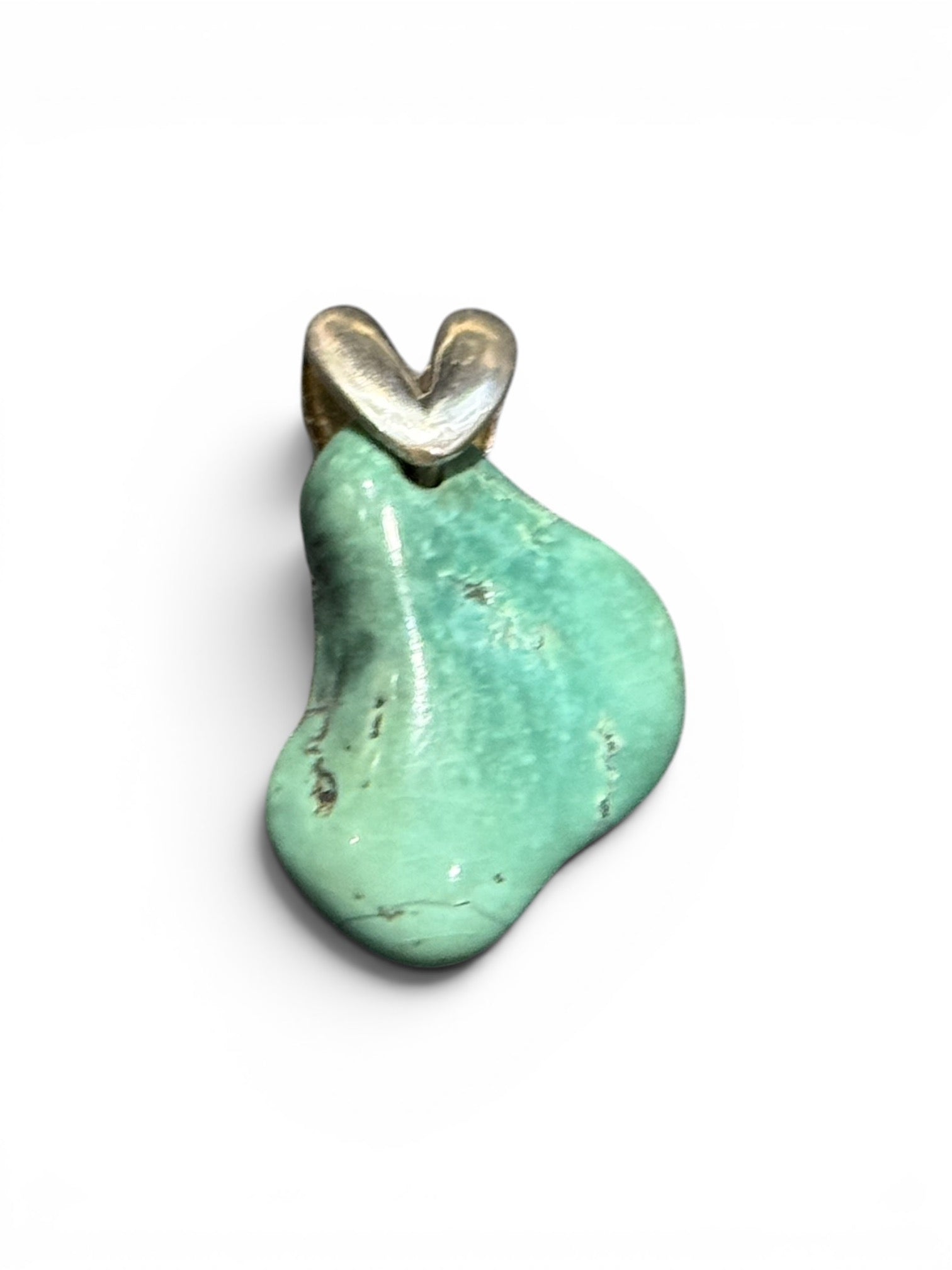 Large, unusual freeform turquoise nugget topped with a striking sterling silver bail. 3.4 cm height including bail