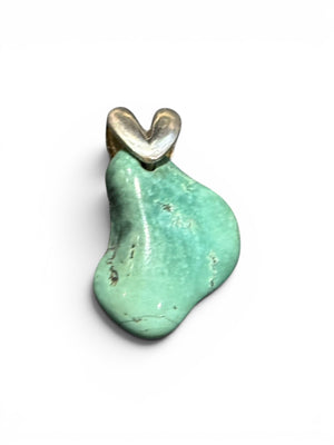 Large, unusual freeform turquoise nugget topped with a striking sterling silver bail. 3.4 cm height including bail