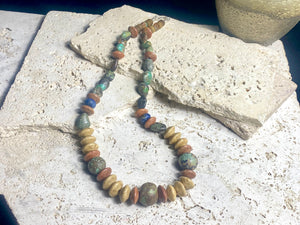 Old Tibetan turquoise, jasper and Afghani lapis lazuli make a standout, long unisex necklace in earthy, natural tones. Sterling silver clasp. Length 59 cm