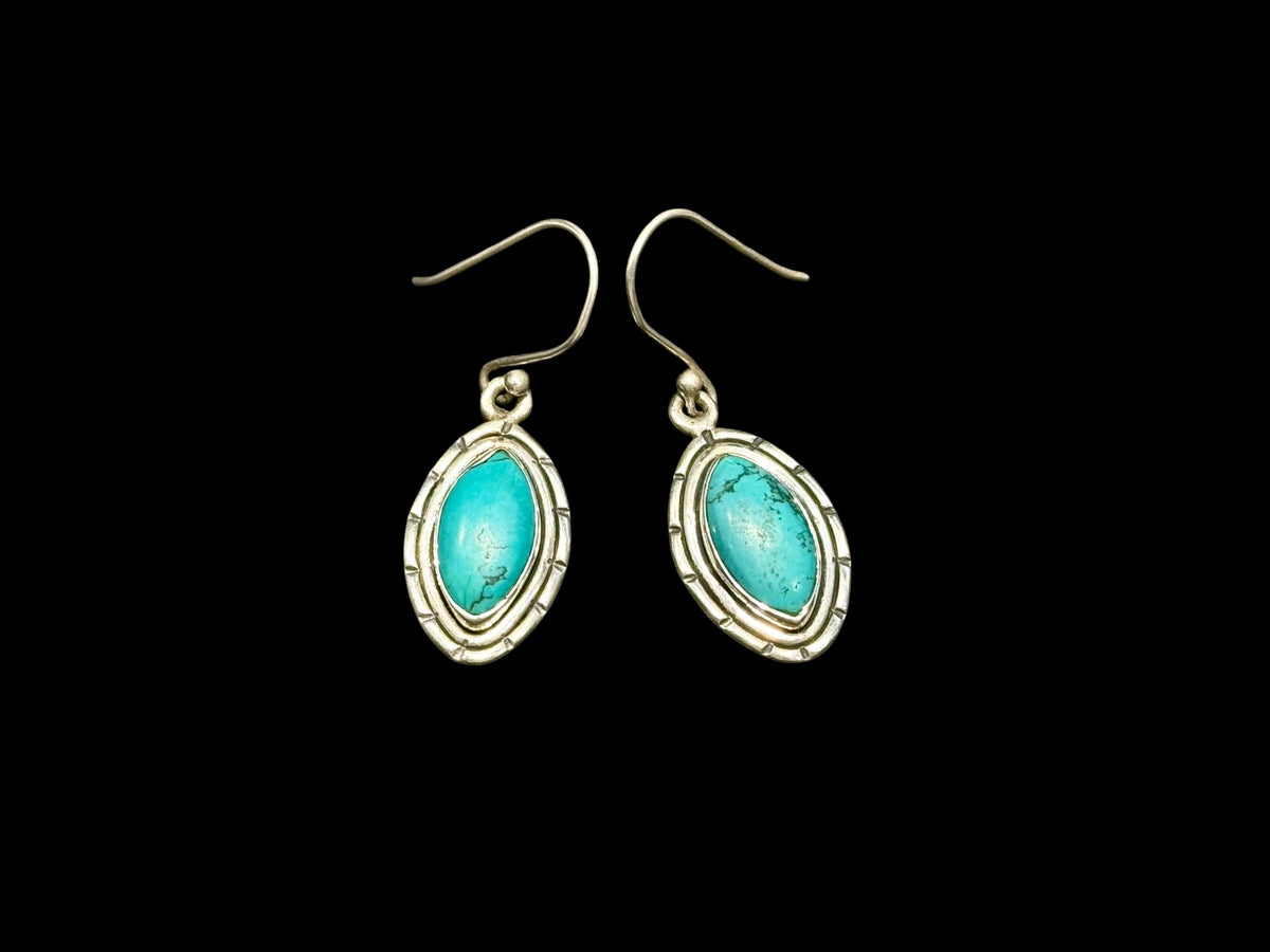 Our southwest earrings are made from Arizona turquoise set in wide sterling silver mounts. Length 4 cm including hook