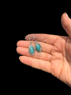 Our southwest earrings are made from Arizona turquoise set in wide sterling silver mounts. Length 4 cm including hook